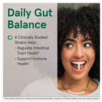 Woman with a supplement in her mouth, promoting daily gut balance with text on a gray background