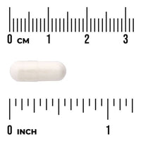 Swanson Biotin capsule shown against a centimetre scale